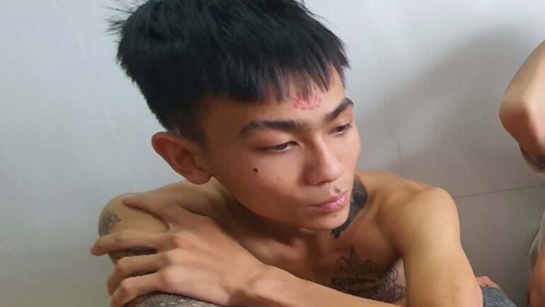 Nguyễn Thành Nhân lúc bị bắt. Ảnh: Ngọc Oanh