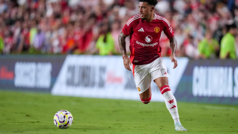 Sancho thi đấu trong trận giao hữu gặp Liverpool trên đất Mỹ hôm 2/8. Ảnh: AFP.